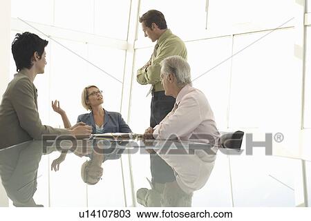 Stock Image - Businesspeople in conference meeting. Fotosearch