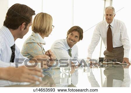 Stock Image - Businesspeople in conference meeting. Fotosearch