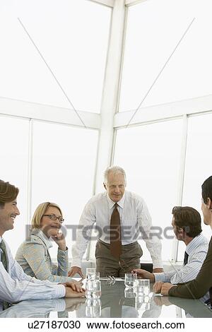 Stock Image - Businesspeople in conference meeting. Fotosearch