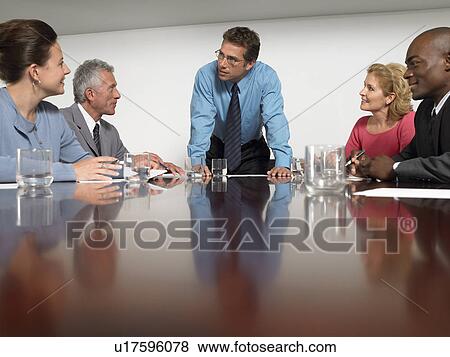 Stock Photo - Businesspeople in conference meeting. Fotosearch