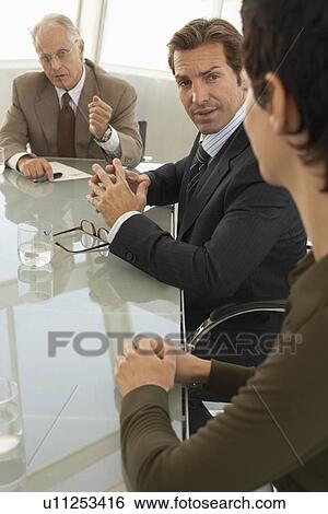 Businesspeople in conference meeting View Large Photo Image Stock Photograph - Businesspeople in conference meeting. Fotosearch