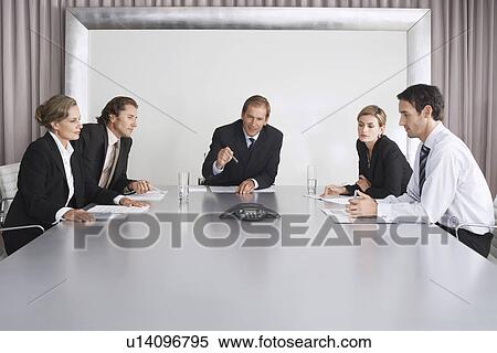 Businesspeople Listening During Teleconference View Large Photo Image Stock Photography - Businesspeople Listening During Teleconference. Fotosearch