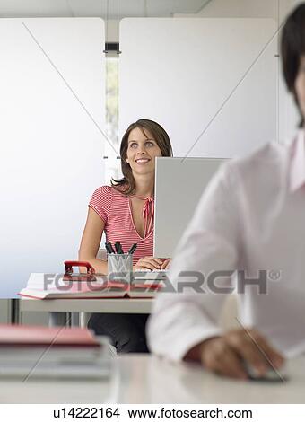 Businesswoman at desk half length View Large Photo Image Picture - Businesswoman at desk half length. Fotosearch