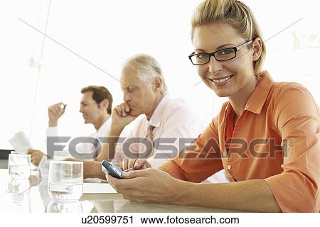 Stock Image - Businesswoman in Meeting. Fotosearch
