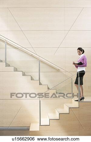 Businesswoman Standing on Stairway View Large Photo Image Stock Photograph - Businesswoman Standing on Stairway. Fotosearch