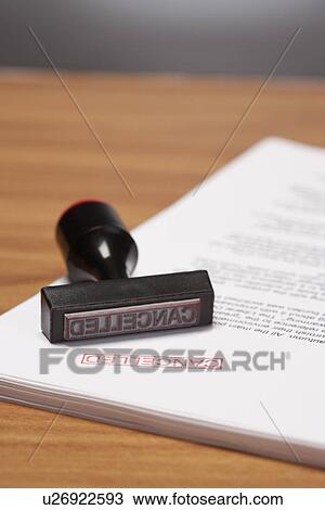 Stock Image - Cancelled Stamp on Paperwork. Fotosearch
