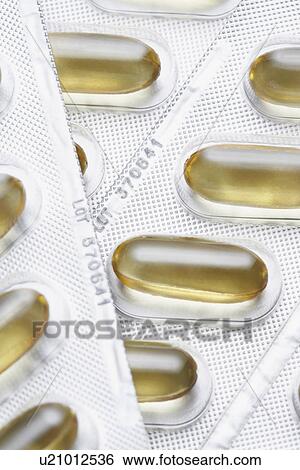 Capsule pills in packaging close-up View Large Photo Image Stock Photograph - Capsule pills in packaging close-up. Fotosearch