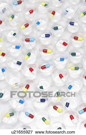 Capsule pills in plastic cups View Large Photo Image Stock Photo - Capsule pills in plastic cups. Fotosearch