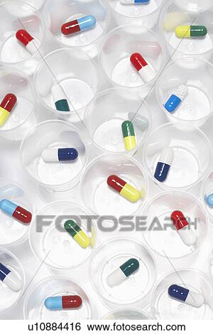 Capsule pills in plastic cups View Large Photo Image Stock Photograph - Capsule pills in plastic cups. Fotosearch