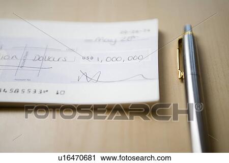 Cheque for one million dollars lying next to pen on table close-up View Large Photo Image Stock Image - Cheque for one million dollars lying next to pen on table close-up. Fotosearch
