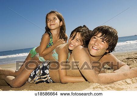 Picture - Children in swimwear playing beach. Fotosearch