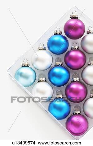 Christmas baubles in tray on white background View Large Photo Image Picture - Christmas baubles in tray on white background. Fotosearch