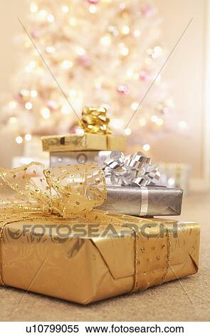 Stock Photography - Christmas gifts on floor. Fotosearch