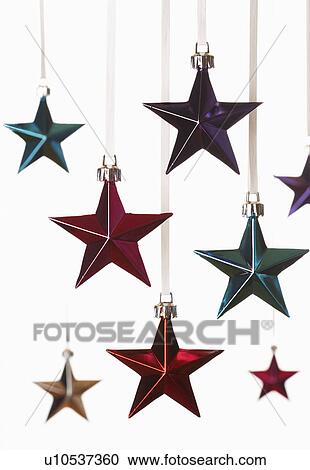 Christmas star ornaments on white background View Large Photo Image Stock Image - Christmas star ornaments on white background. Fotosearch
