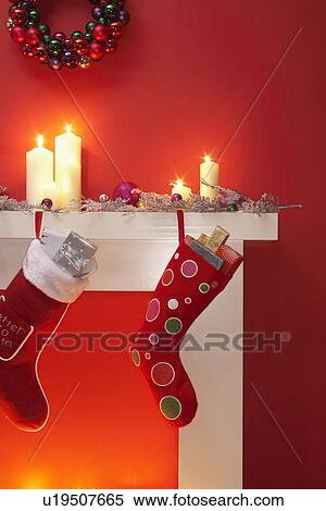 Christmas stockings hanging over fireplace View Large Photo Image Stock Photography - Christmas stockings hanging over fireplace. Fotosearch