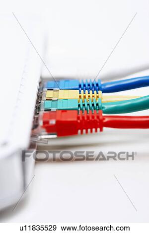 Stock Photo - Colourful row of network connection plugs. Fotosearch