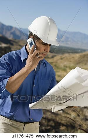 Construction worker using mobile phone portrait View Large Photo Image Stock Photography - Construction worker using mobile phone portrait. Fotosearch