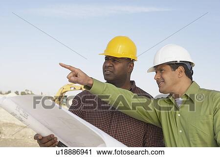 Construction Workers Reading Blueprints View Large Photo Image Stock Image - Construction Workers Reading Blueprints. Fotosearch
