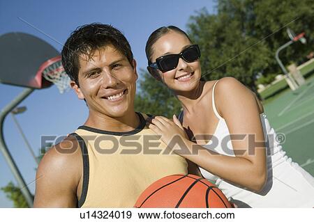 Couple at Basketball Court. View Large Photo Image Stock Photo - Couple at Basketball Court.. Fotosearch