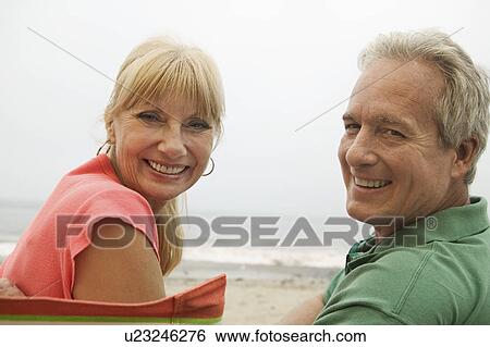 Couple at beach (portrait) View Large Photo Image Stock Photograph - Couple at beach (portrait). Fotosearch