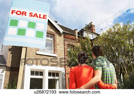 Stock Image - Couple Buying Home Together. Fotosearch