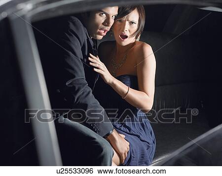 Couple in back of limousine View Large Photo Image Stock Photograph - Couple in back of limousine. Fotosearch