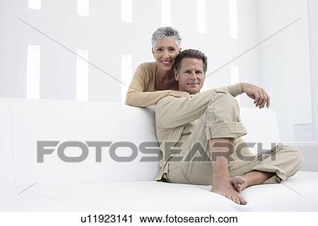 Couple in living room portrait View Large Photo Image Stock Image - Couple in living room portrait. Fotosearch