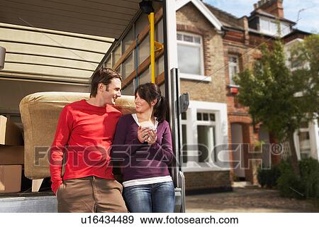 Couple Leaning On Back of Removals Van View Large Photo Image Stock Photo - Couple Leaning On Back of Removals Van. Fotosearch