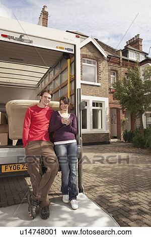 Couple Moving into New Home View Large Photo Image Stock Image - Couple Moving into New Home. Fotosearch