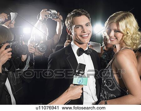 Couple photographed by paparazzi View Large Photo Image Stock Image - Couple photographed by paparazzi. Fotosearch
