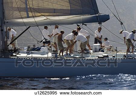 Crew working on yacht side view View Large Photo Image Stock Photography - Crew working on yacht side view. Fotosearch