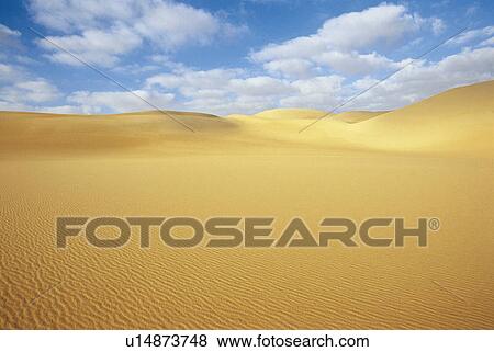 Desert and sand dunes under blue sky View Large Photo Image Stock Photo - Desert and sand dunes under blue sky. Fotosearch