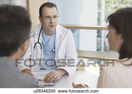 Stock Image - Doctors on Work Break in Cafeteria. Fotosearch