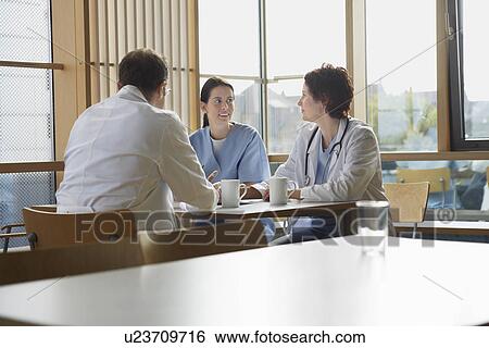 Stock Photograph - Doctors on Work Break in Cafeteria. Fotosearch