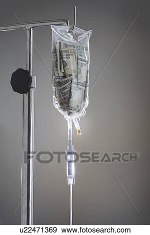 Drip bag on stand against grey background View Large Photo Image Stock Photo - Drip bag on stand against grey background. Fotosearch