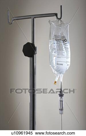 Stock Photography - Drip bag on stand against white background. Fotosearch