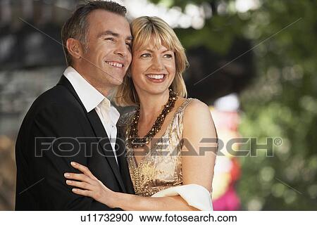 Stock Image - Elegant couple on London street ouside building close up. Fotosearch