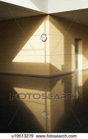 Empty corridor with clock on wall View Large Photo Image Stock Photo - Empty corridor with clock on wall. Fotosearch