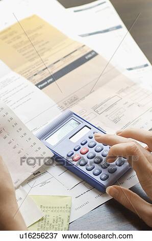 Expenses being calculated View Large Photo Image Stock Photo - Expenses being calculated. Fotosearch