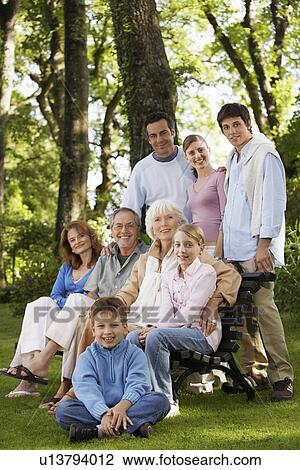 Family posing for portrait in back yard portrait View Large Photo Image Stock Image - Family posing for portrait in back yard portrait. Fotosearch