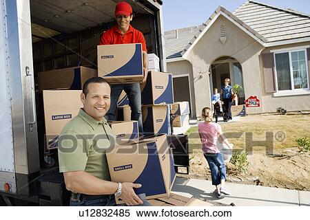 Family unloading removal van in front of house View Large Photo Image Stock Photography - Family unloading removal van in front of house. Fotosearch