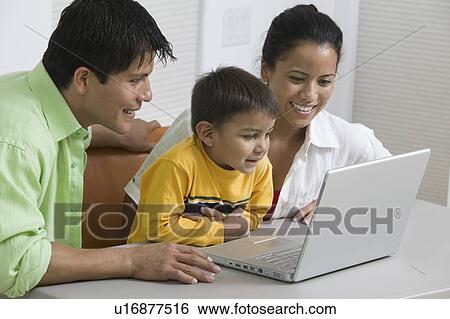 Family Using Laptop close up View Large Photo Image Stock Photograph - Family Using Laptop close up. Fotosearch