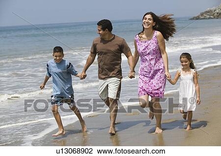 Family Walking on the Beach View Large Photo Image Stock Image - Family Walking on the Beach. Fotosearch