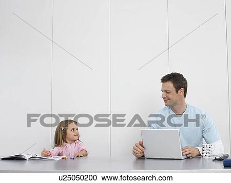 Father and daughter drawing and using laptop View Large Photo Image Stock Image - Father and daughter drawing and using laptop. Fotosearch