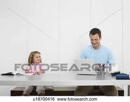 Father and daughter drawing and using laptop View Large Photo Image Stock Photograph - Father and daughter drawing and using laptop. Fotosearch