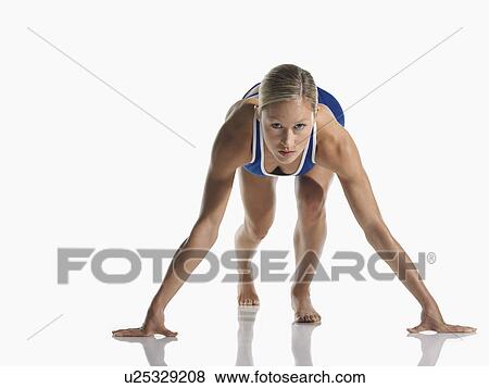 Stock Photo - Female athlete in starting position. Fotosearch