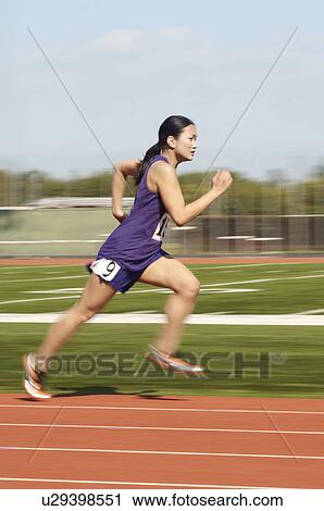 Female athlete running side view View Large Photo Image Stock Image - Female athlete running side view. Fotosearch