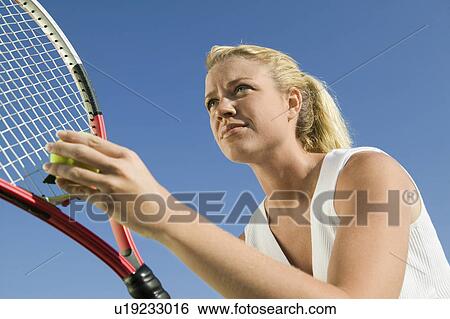 Female Tennis Player Preparing to Serve low angle view close up View Large Photo Image Stock Photograph - Female Tennis Player Preparing to Serve low angle view close up. Fotosearch