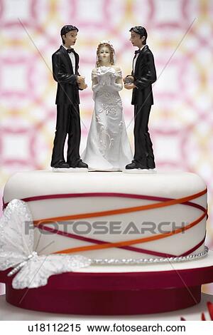Stock Photography - Figurines on Wedding Cake. Fotosearch