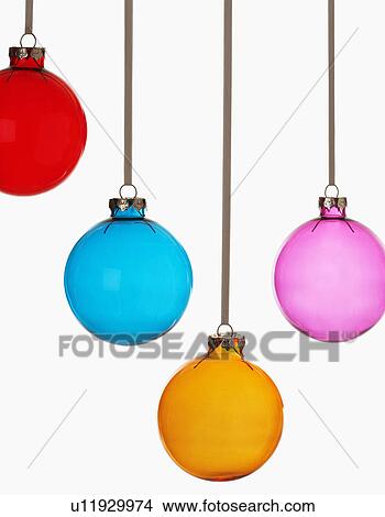 Picture - Four Christmas baubles on white background. Fotosearch